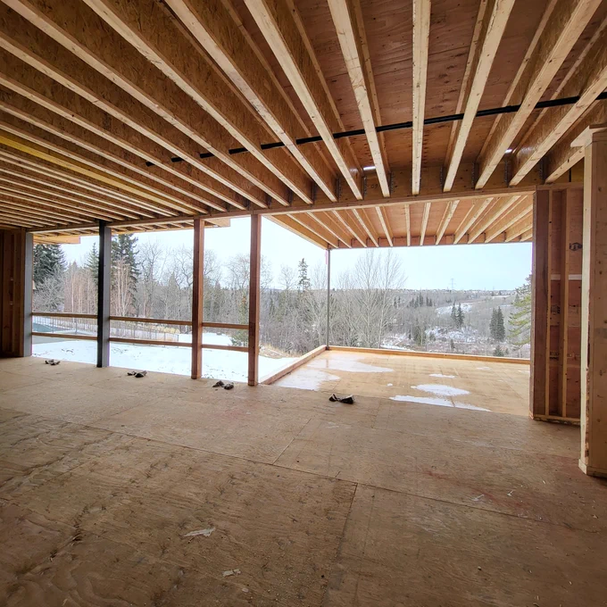 :: lookout | #thirdstone_inc 

Designed to frame & heighten the experience of views overlooking Whitemud Creek. The lookout house acts as a "mediator" between its occupants & the vast territory it overlooks. 

This view from the Primary Bedroom with access to a floating terrace that cantilevers over a sloping site rising above  the forest canopy. 

The lookout house is at framing stage and  is scheduled for completion in 2026. 

Design :: thirdstone inc.
Builder :: Birkholz