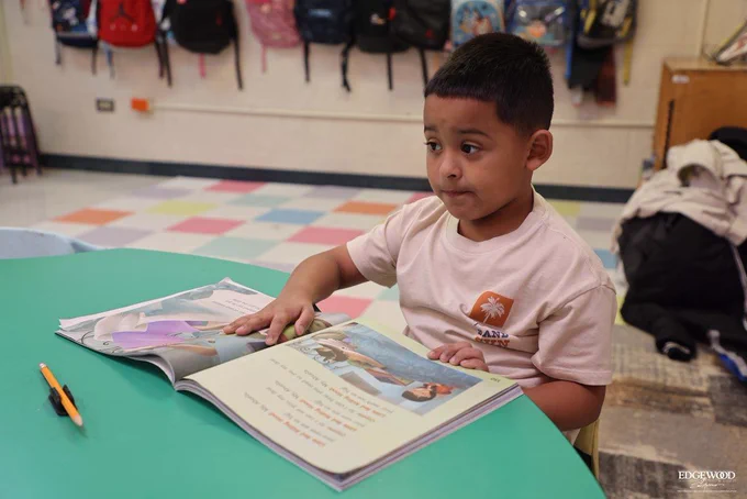 LBJ student reading a book 