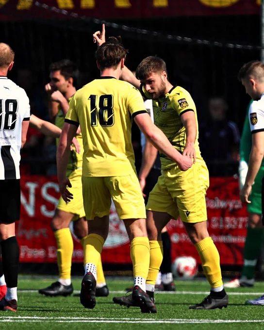 Adam Hailes celebrates scoring for Guilsfield against Llandudno.