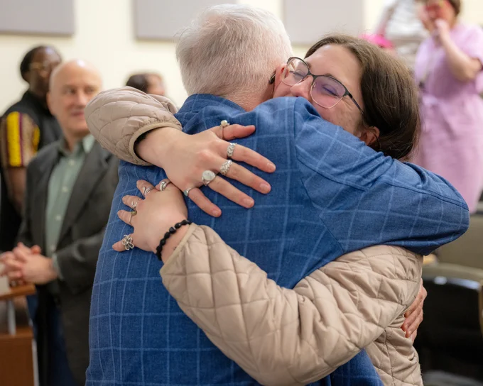 Dean Scott Titsworth in a middle of a hug.
