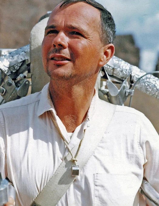 USGS Astrogeology founder Gene Shoemaker with a rocket pack on his back and a hand lens around his neck