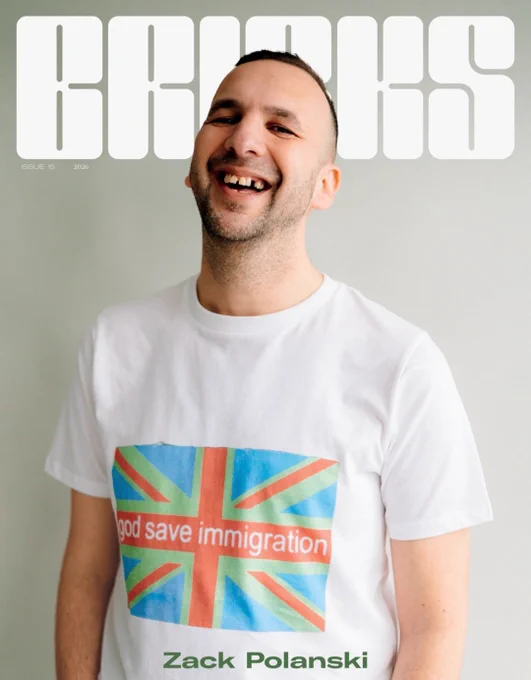 Bricks Magazine - Zack in a t-shirt saying god save immigration 