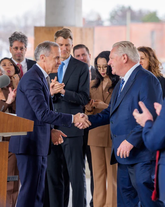 Prime Minister Carney and Premier Ford shake hands during a housing announcement in Etobicoke, Ontario.