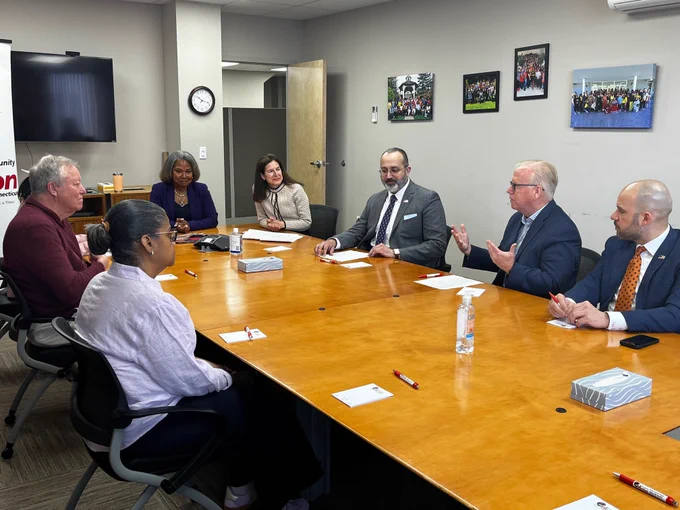 DRS Commissioner Mark Boughton joins state and local officials in a discussion about the VITA program in a conference room in Danbury, CT. 