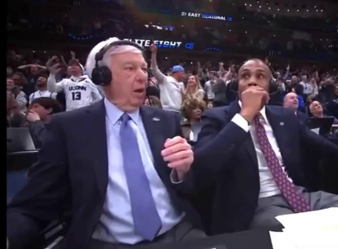 College basketball commentators looked shocked  reacting to a buzzer beater during March Madness. Image is used for a meme
