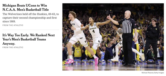 Photo on nytimes.com showing two Michigan players celebrating and a referee prominently in the foreground