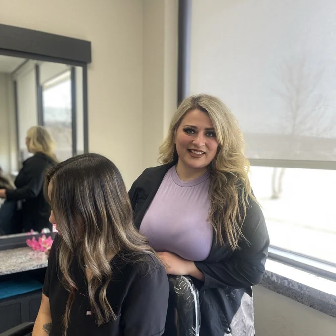 hair stylist displaying a balayage