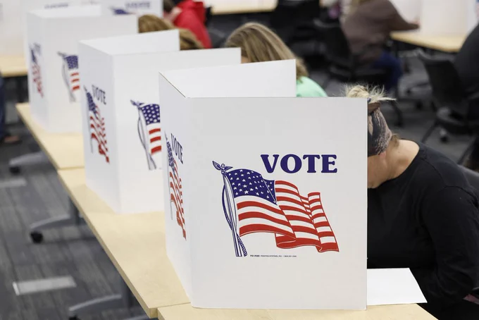 people at voting booth