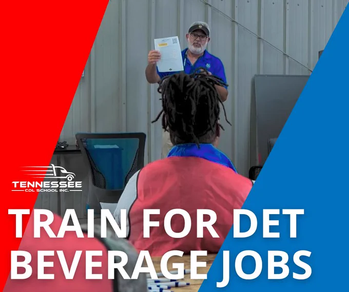 A person in a blue shirt holds up a document while training a seated individual for beverage service jobs in a classroom setting.