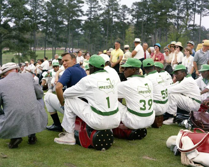 Arnold Palmer with caddies. Augusta National, Getty Images