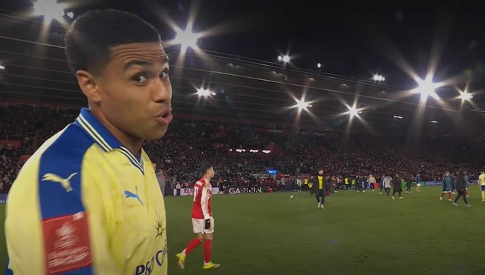 A screenshot of Shea Charles looking at the camera following the full time whistle and puffing his cheeks out. 