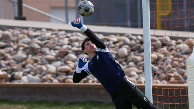 Zach MacDonald punches a cross clear during keeper drills