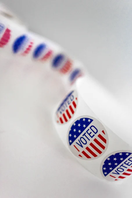 Stickers that read "I voted" and have elements of the United States flag on them.