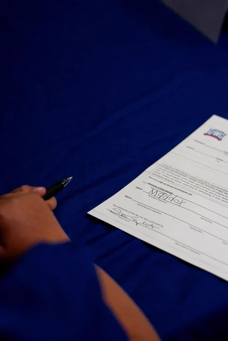 A piece of paper on a blue table cloth