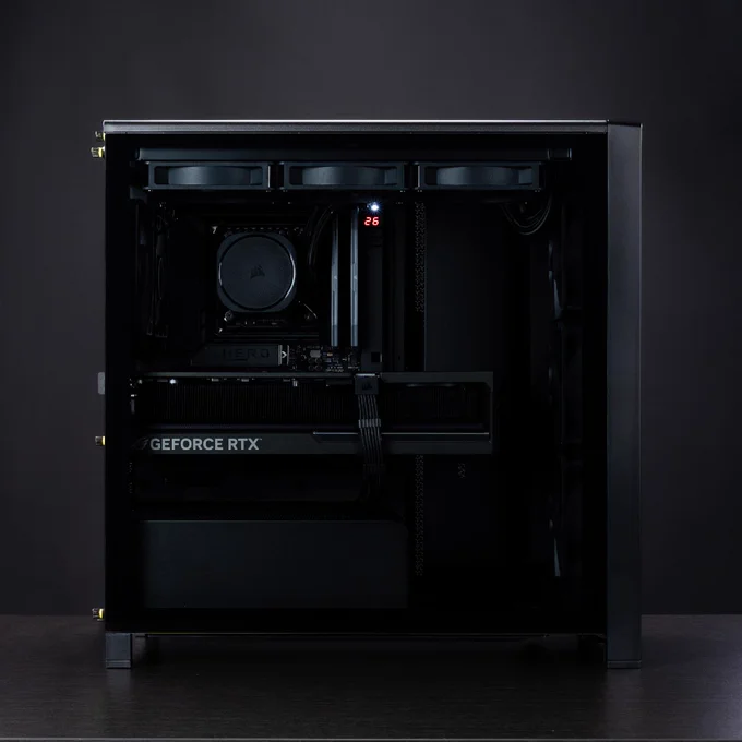 A dynamic image of an all black COrsair build, created in the FRAME Configurator.  The front panel is a dark wood aesthetic that offsets the solid black coloration.   