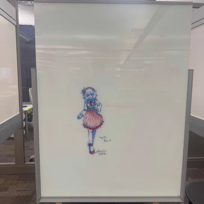 Artwork by a UCO Student of a girl done with red and blue dry erase markers.