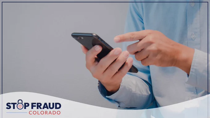 Person using a smartphone with the logo for Stop Fraud Colorado visible in the corner.