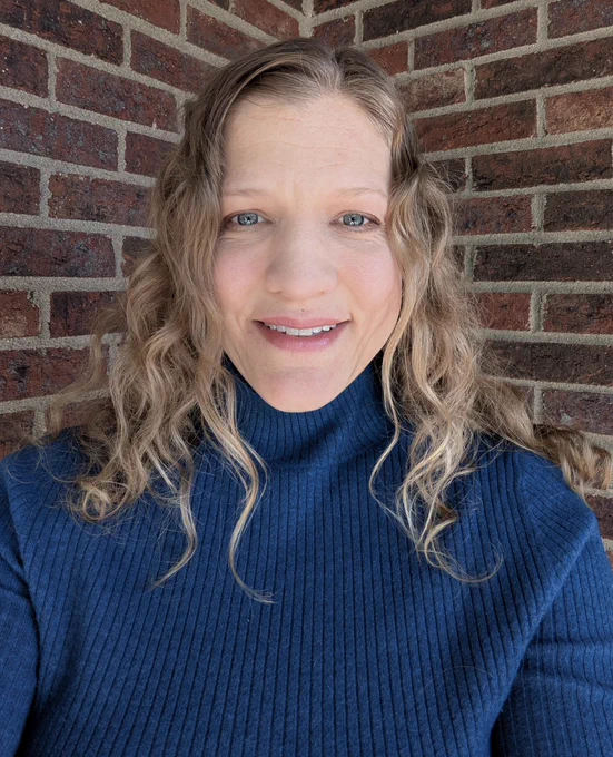 Image of a young woman wearing a blue turtleneck in support of Ohio Wears Blue Day.