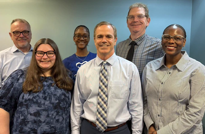 Image of CASA of Franklin County Staff members wearing various shades of blue in support of Child Abuse Prevention Month.