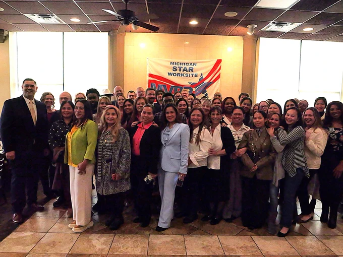 Cintas Corporation’s K15 facility employees in Westland gather for a group photo during their MIOSHA MVPP Star Award recognition ceremony.