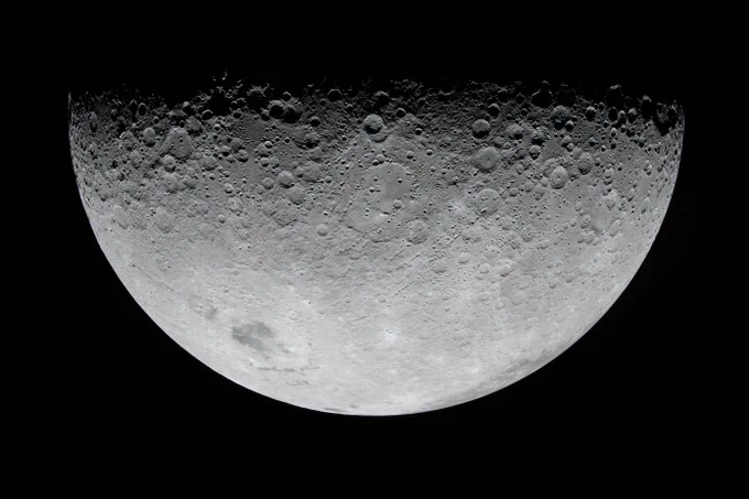 The line between night and day, or the terminator, is at the top of this image of the Moon. As the Artemis II crew described, the terminator is \"anything but a straight line.\" The Moon's surface is heavily cratered at the top, but the number of craters tapers off as you continue downward. Credit: NASA