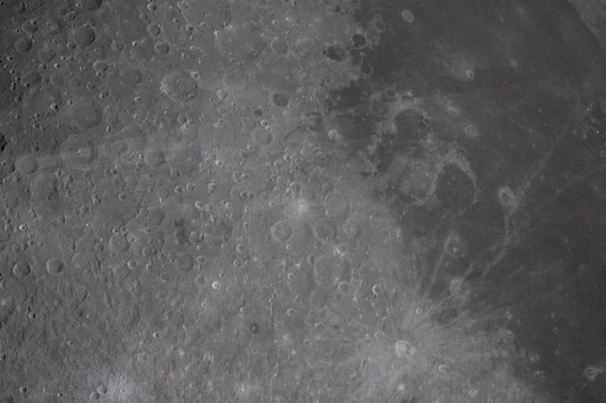 The small, bright spot in the center of the image is the crater that the Artemis II crew have proposed as Carroll, after Commander Reid Wiseman\u2019s late wife. About 3.5 miles across (5.6 km in diameter), the proposed Carroll crater is on the nearside of the lunar surface on the western edge and would be visible from Earth with powerful telescopes. Credit: NASA