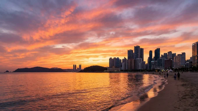 Sunset view of Busan Haeundae coastline with golden reflections and serene travel atmosphere