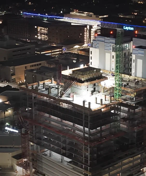 Nighttime photo of Astria Tempe high-rise off-campus University of Arizona student residential housing construction project, courtesy of Layton Construction
