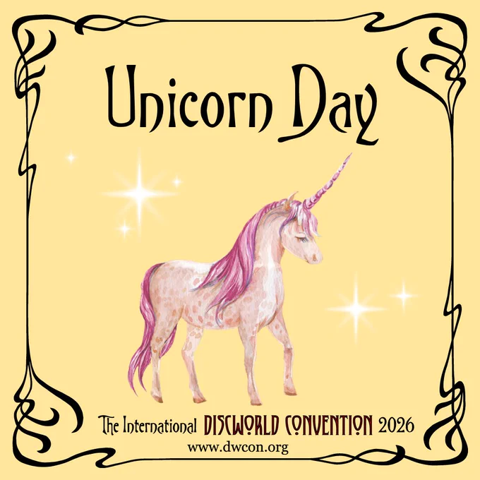 Pale yellow square background with black art nouveau border and text reading "Unicorn Day".  Below it sits a watercolour drawing of a pink unicorn surrounded by white sparkles
