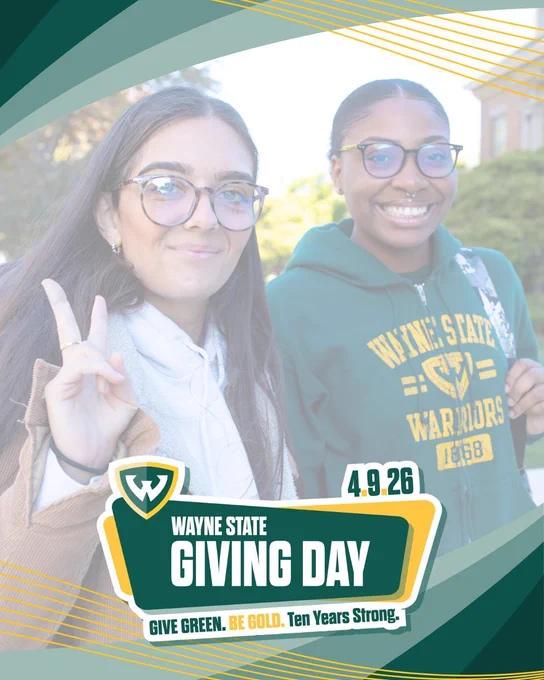 Two women in WSU gear smile at the camera as one gives the peace sign. Logo reads: Wayne State Giving Day 4-9-26
