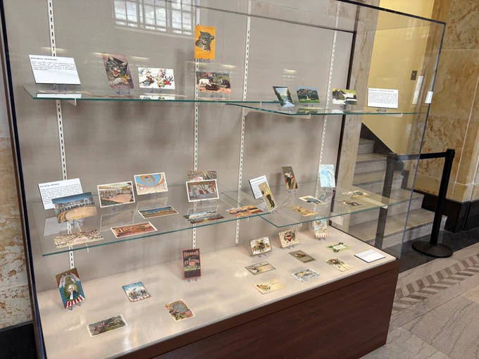Display case full of postcards. 
