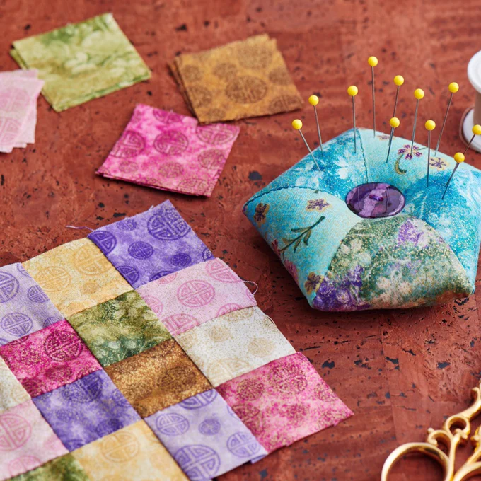 Example of raised quilting alongside materials and supplies.