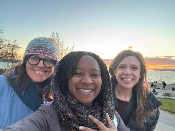 Laura Rice, Maurita Harris, and Elena Remillard at the beach at sunset