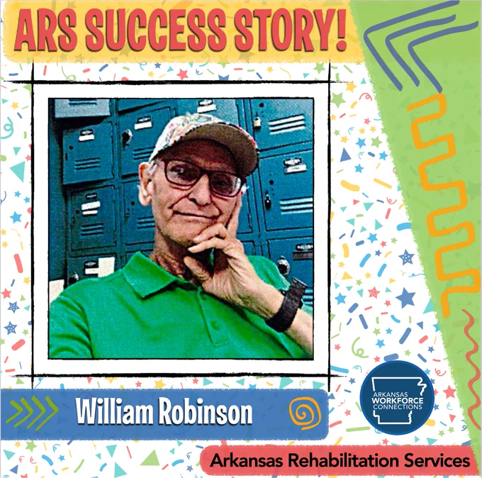 William Robinson sitting and smiling for the camera.