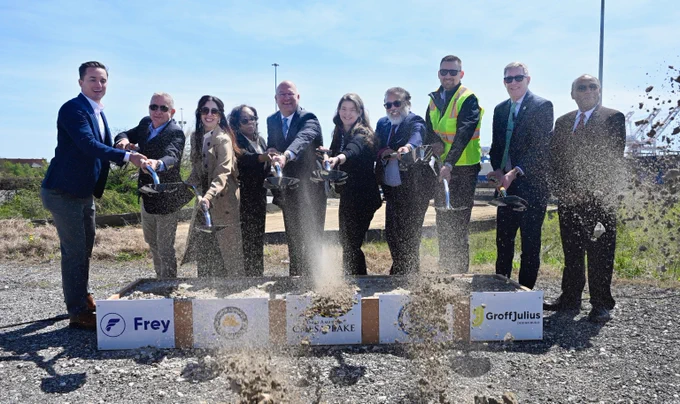 Group shot of officials at groundbreaking. They did a symbolic dig.