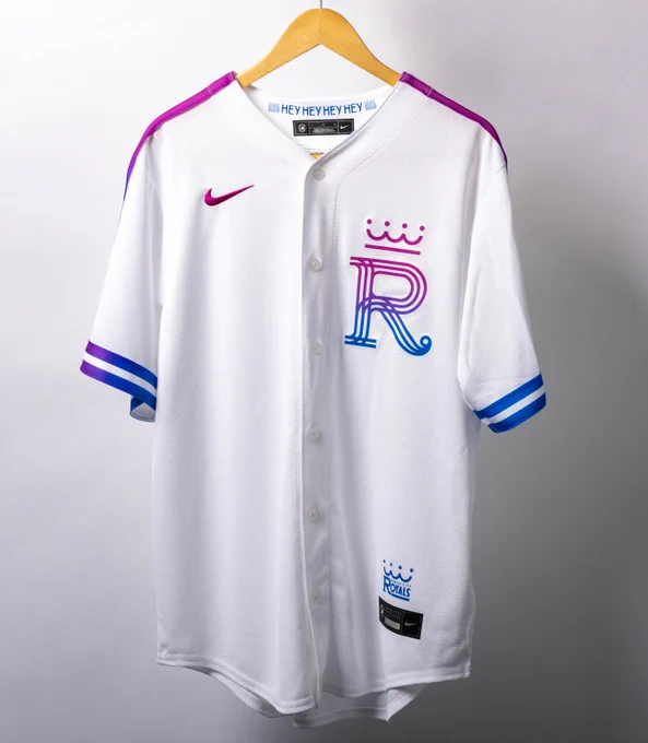 A white Kansas City Royals City Connect jersey with purple and blue lettering.