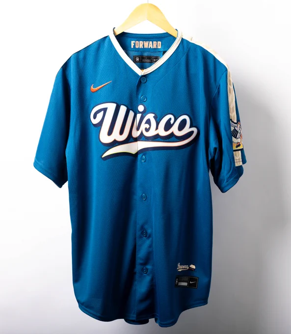 A blue Milwaukee Brewers City Connect jersey with white and orange lettering. 