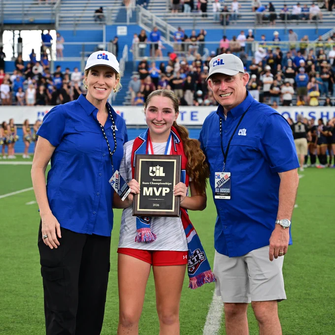 Emma Durkin posed with MVP plaque and UIL staff. 