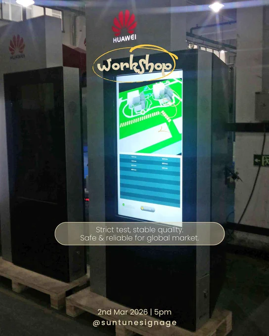 Outdoor LCD digital signage cabinet exposed to simulated sunlight testing in laboratory.