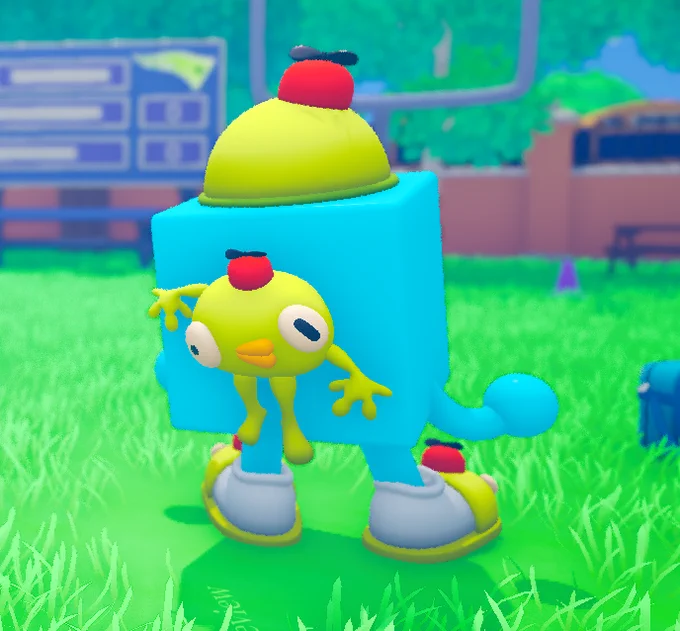 The same blue cube character turns slightly, showing a small yellow creature accessory hanging from its side, with matching hat and slippers in a bright outdoor setting.