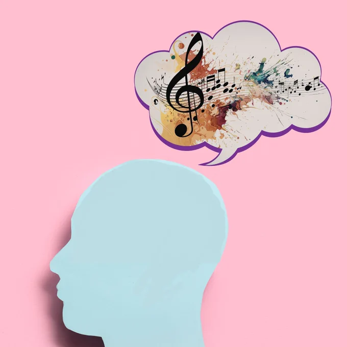 photo illustration of a head with a thought bubble full of music