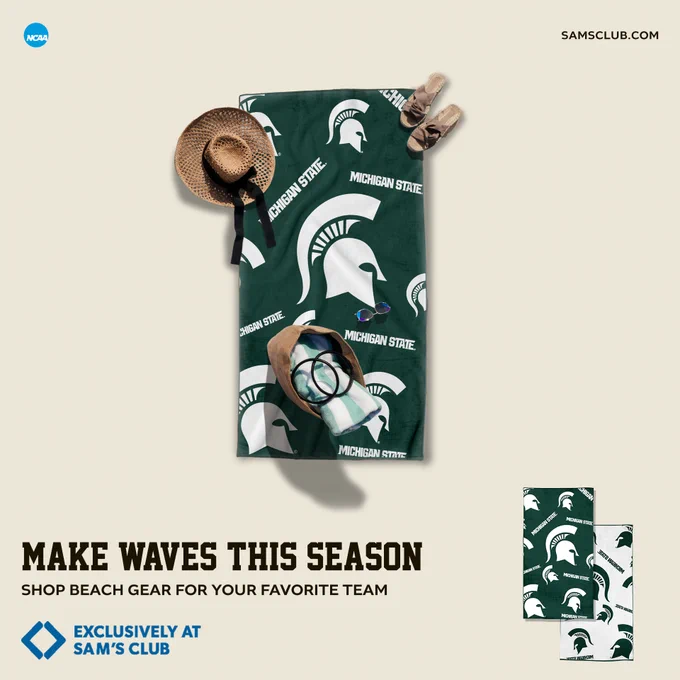 Michigan State Spartans beach towel with sunglasses, hat, and sandals, promoting team-themed summer gear at Sam’s Club.