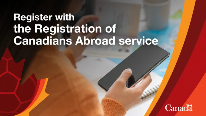 Person looking at their phone.  Graphic text reads: Register with the Registration of Canadians Abroad service. Canada wordmark. 