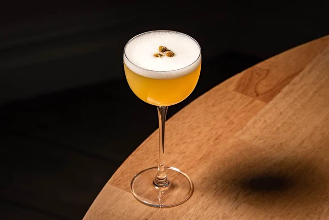 Chamomile cocktail with a 3 seeds as garnishes