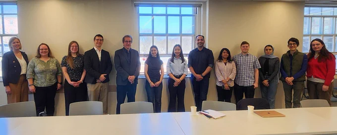 IMAGE: Group portrait showing Alejandro Adem and Anne-Marie Thompson, accompanied by representatives from University of New Brunswick. 