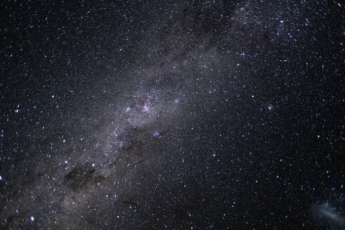 A photo with a wide-field view of a galaxy of stars.