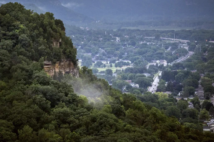 hills and cliffs surrounding a small town