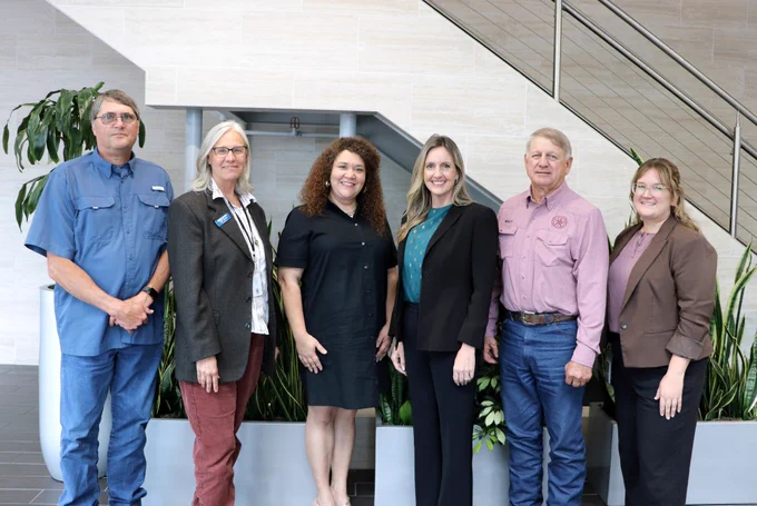 Speakers for the CAPCOG TxCDBG Regional Outreach and Community Development Forum pose for a photo at the CAPCOG offices after the meeting on April 9, 2026.
