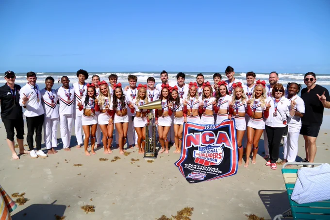 Texas Tech Cheer's Large Coed Team at the beach after winning the national championship.