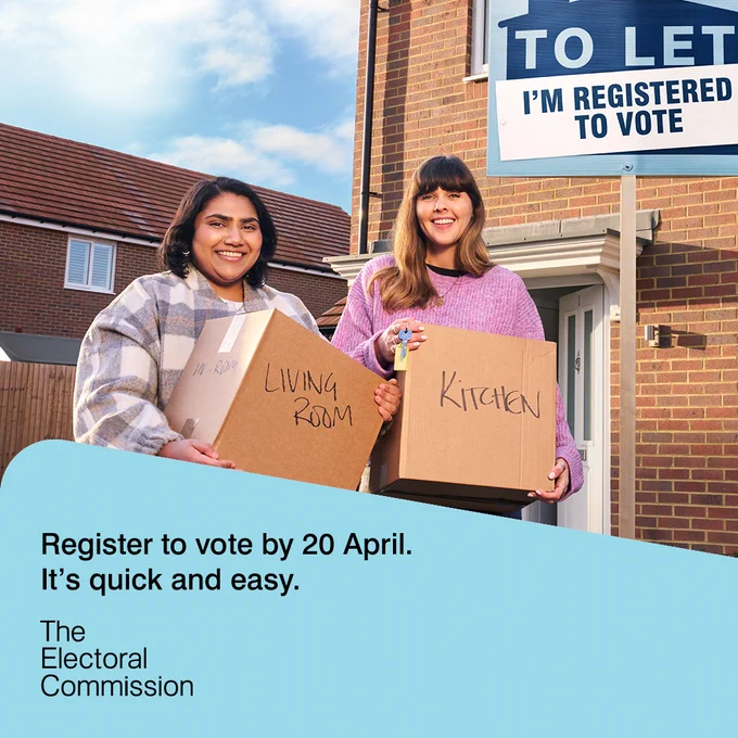 Two women holding moving boxes labeled 'Living Room' and 'Kitchen' stand outside a brick house with a 'To Let' sign stating 'I'm registered to vote'.